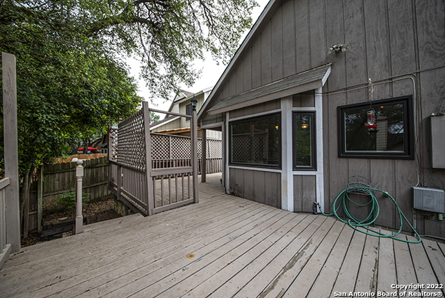 16807 Cedar Tree Way San Antonio, TX 78247 - Photo 24 of 30 a backyard of a house with wooden floor and fence