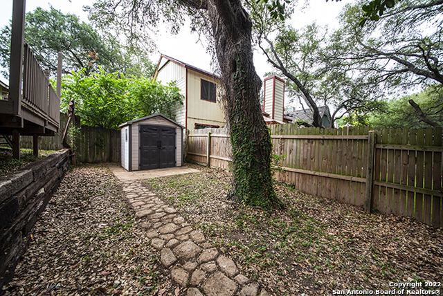 16807 Cedar Tree Way San Antonio, TX 78247 - Photo 26 of 30 a backyard of a house with lots of green space