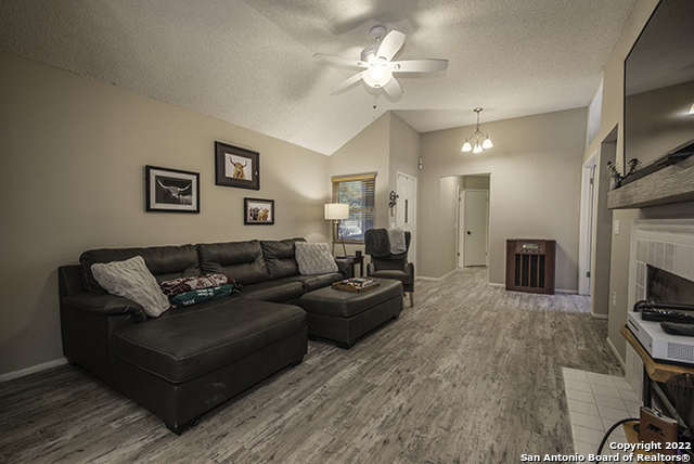 16807 Cedar Tree Way San Antonio, TX 78247 - Photo 10 of 30 a living room with furniture and a flat screen tv
