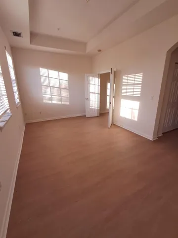 a view of a hallway with windows