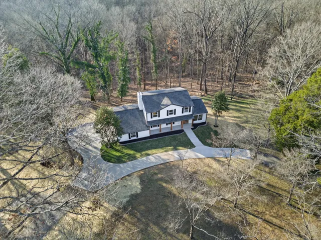 a sign board with a yard