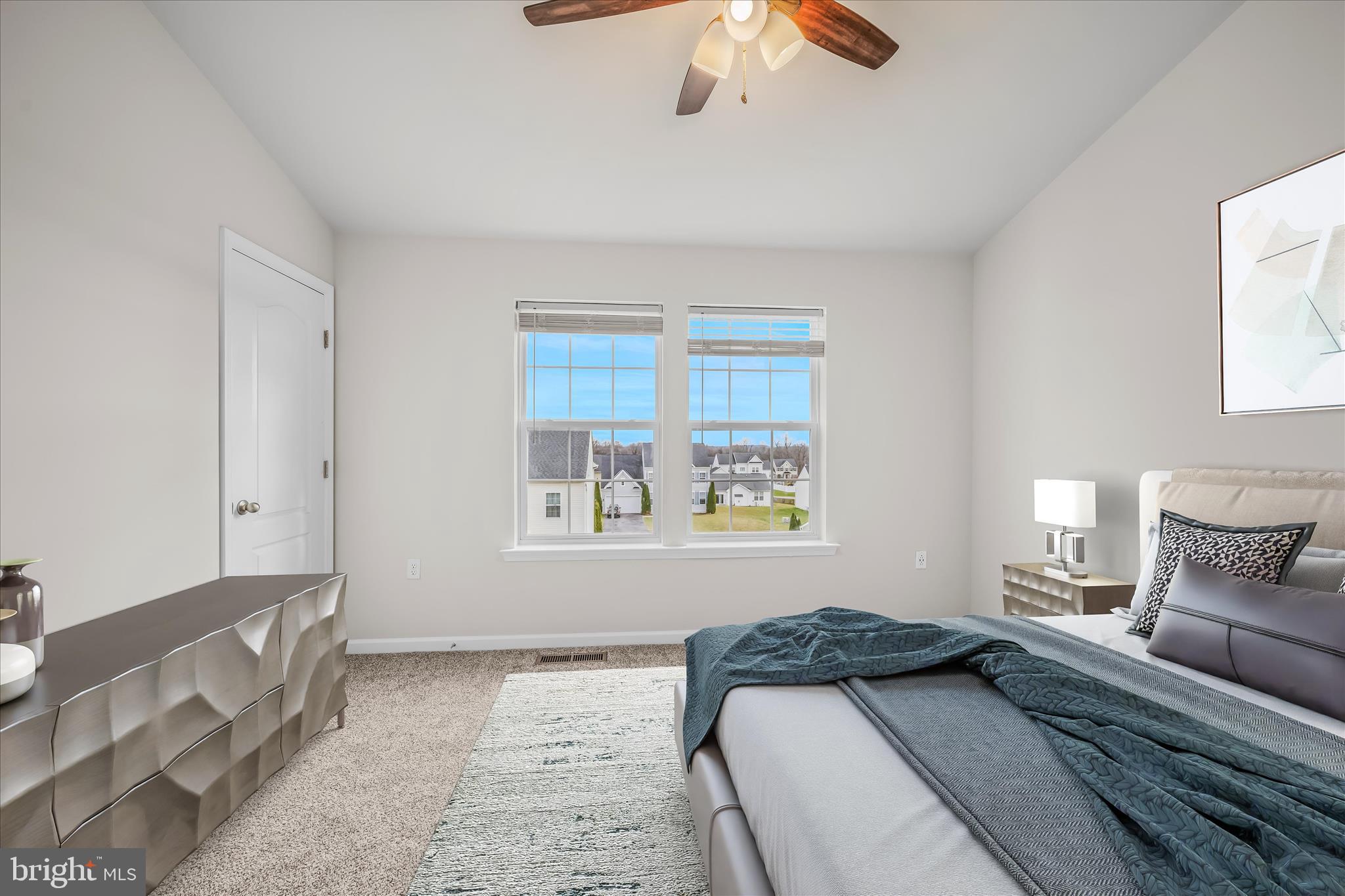 386 Rumbling Rock Road Hedgesville, WV 25427 - Photo 24 of 39 a bedroom with a large bed and a window