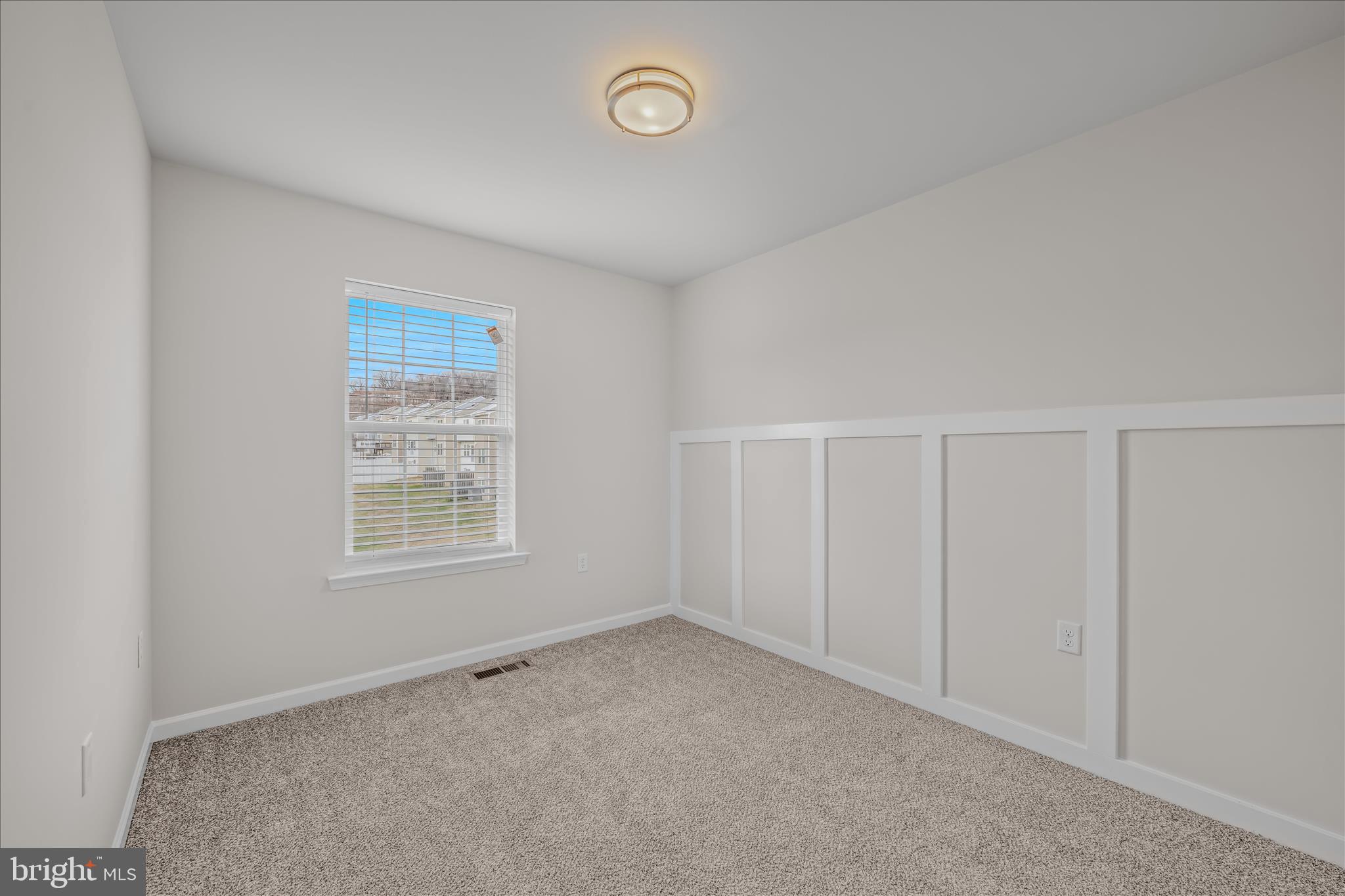 386 Rumbling Rock Road Hedgesville, WV 25427 - Photo 34 of 39 an empty room with a window