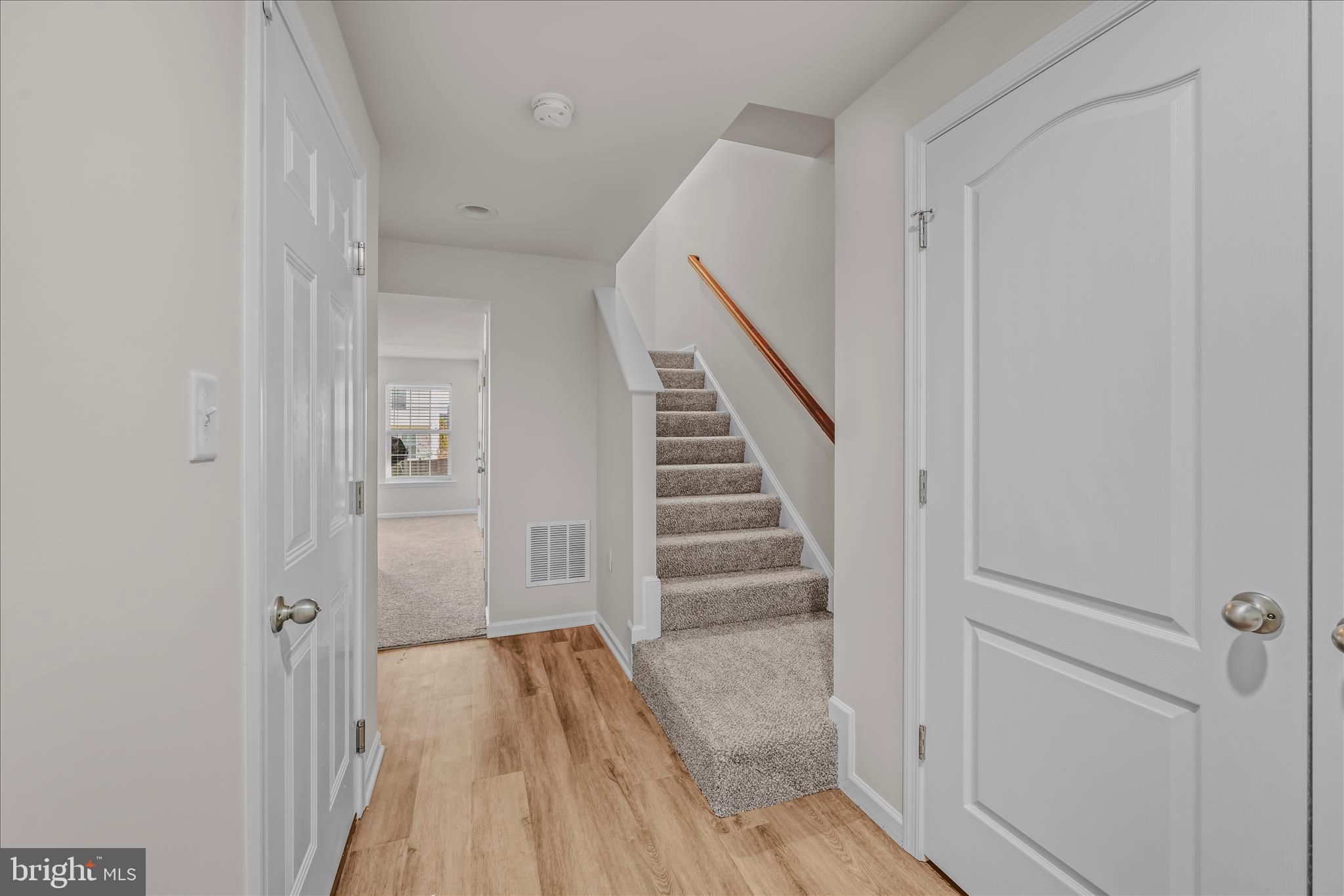 386 Rumbling Rock Road Hedgesville, WV 25427 - Photo 5 of 39 a view of a hallway with wooden floor and entryway