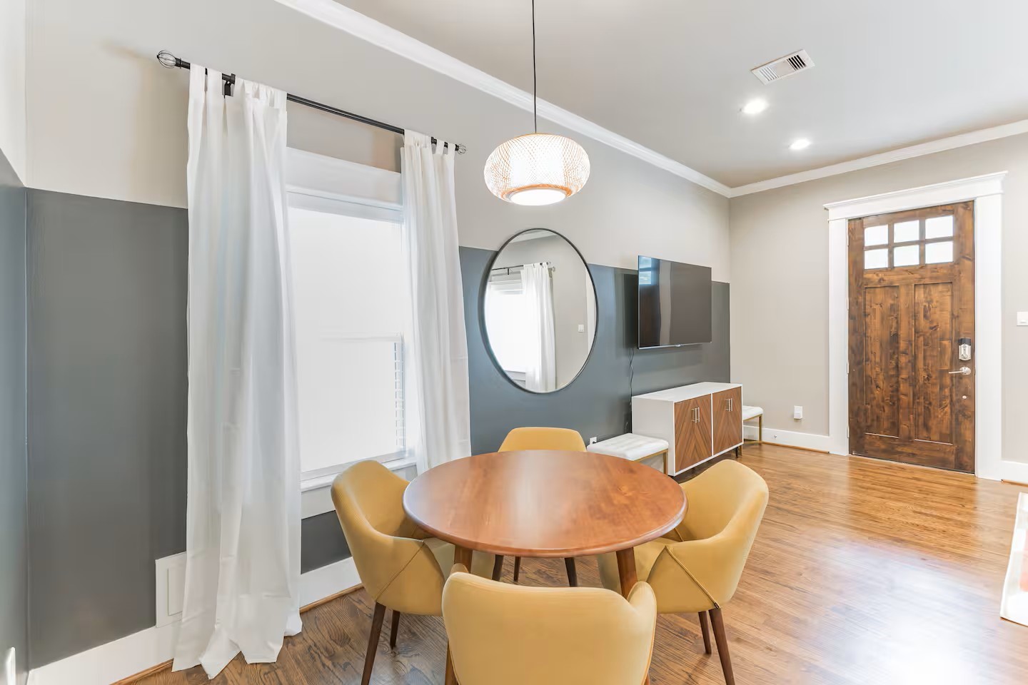 1006 Enid Street, Unit B Houston, TX 77009 - Photo 12 of 26 a view of a dining room with furniture window and wooden floor