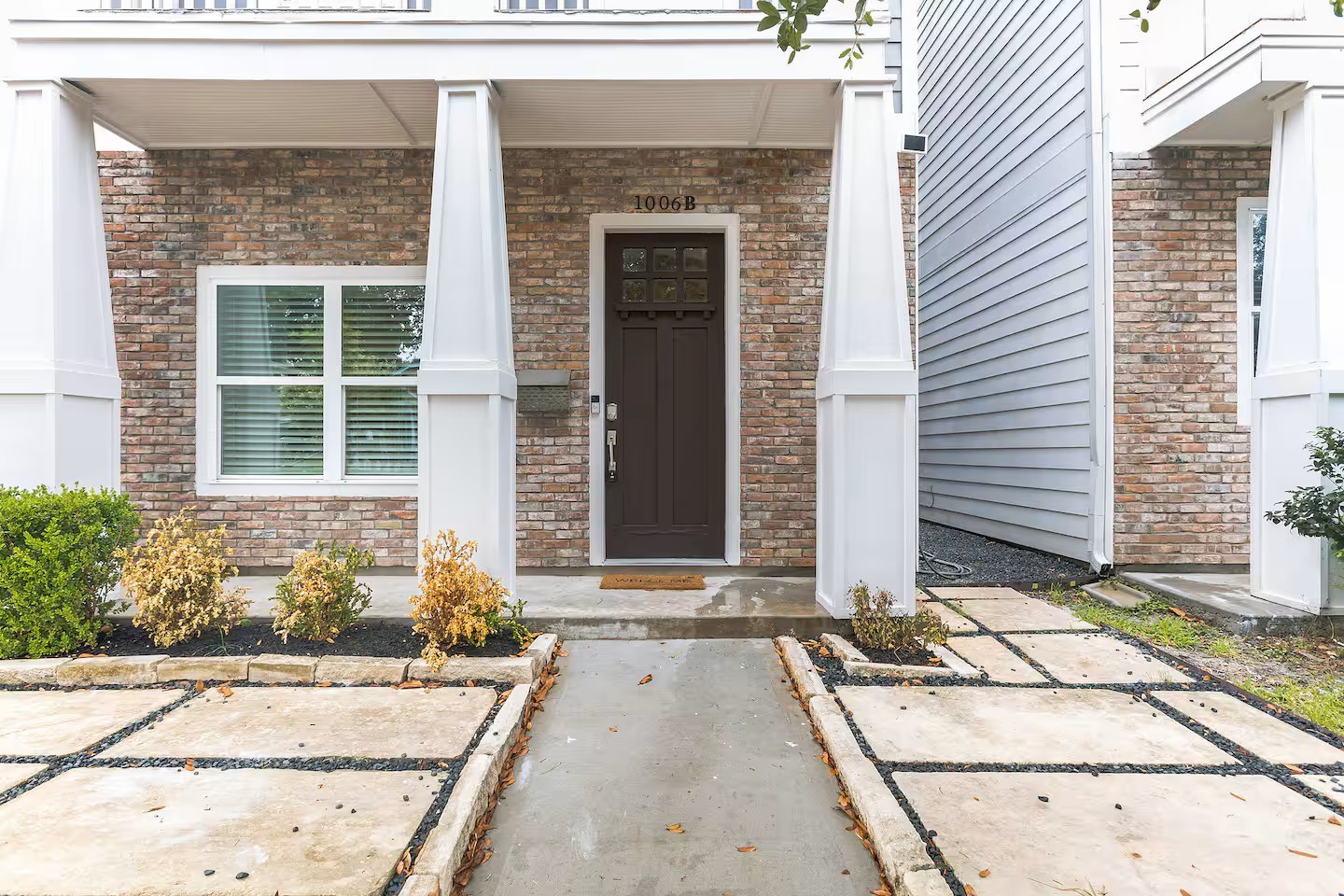 1006 Enid Street, Unit B Houston, TX 77009 - Photo 2 of 26 a front view of a house with a empty space