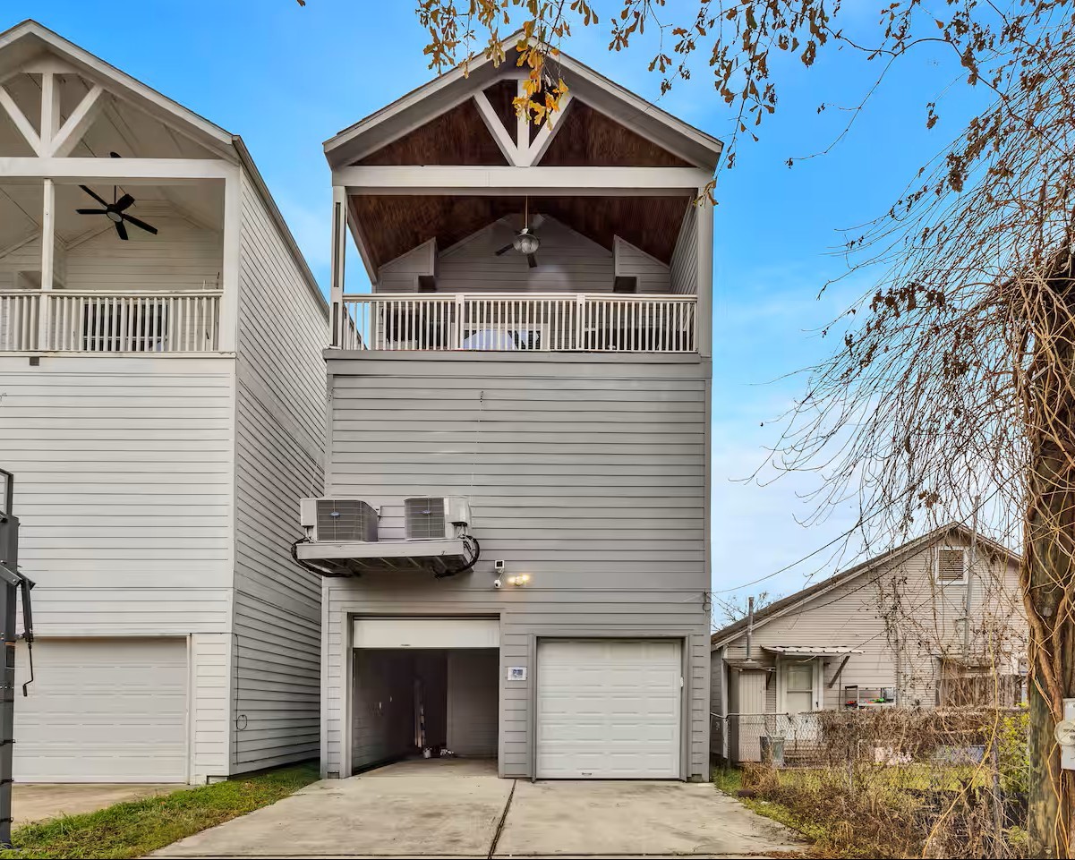 1006 Enid Street, Unit B Houston, TX 77009 - Photo 25 of 26 a front view of a house with a garage