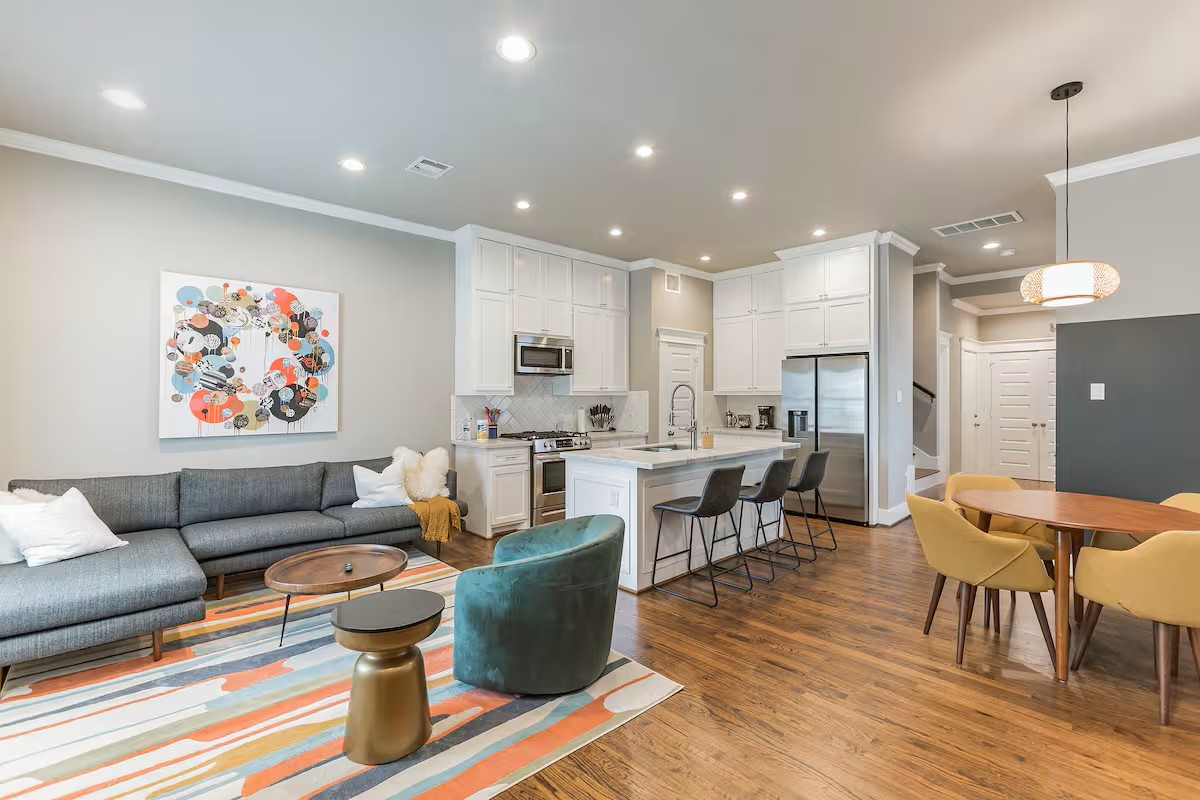 1006 Enid Street, Unit B Houston, TX 77009 - Photo 26 of 26 a living room with fireplace furniture and a dining table with wooden floor