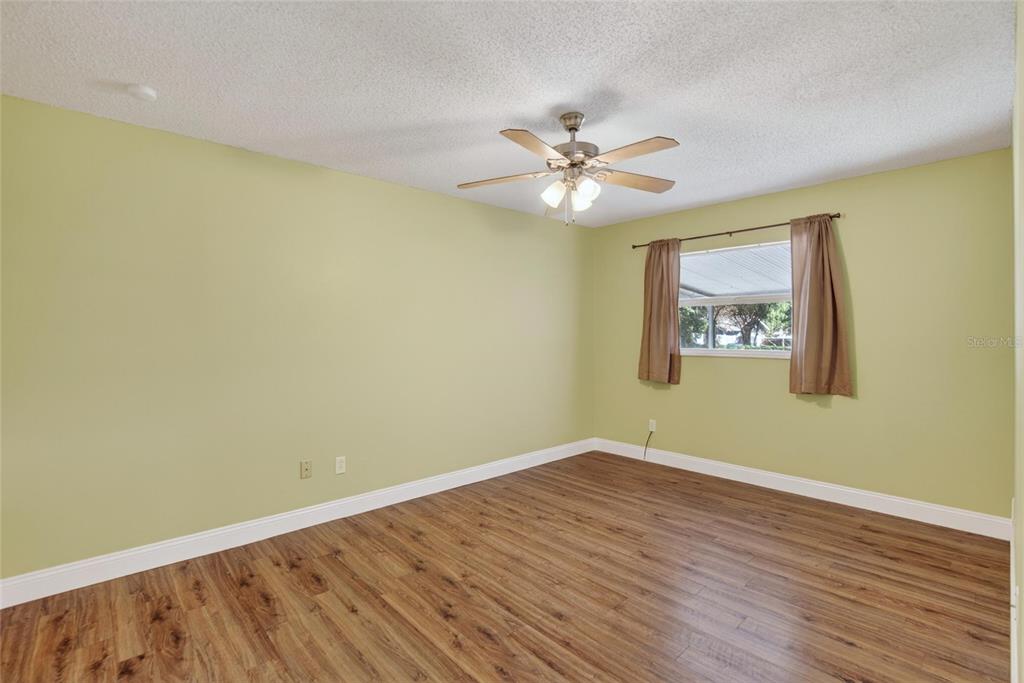 2340 Merrily Circle South Seffner, FL 33584 - Photo 19 of 52 a view of empty room with wooden floor