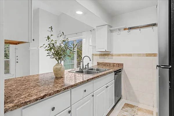 a kitchen with sink and window