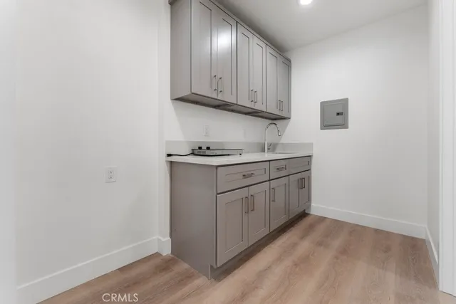 a kitchen with white cabinets