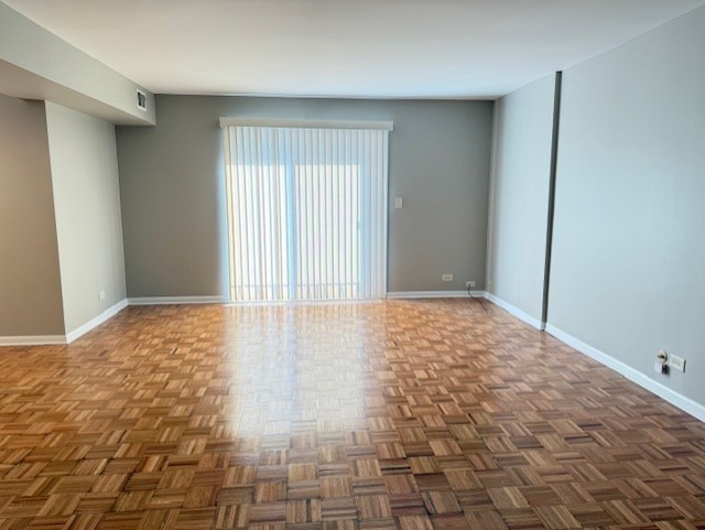5240 Galitz Street, Unit 304 Skokie, IL 60077 - Photo 5 of 18 a view of an empty room and window