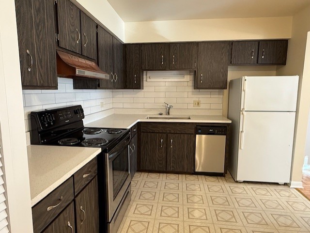 5240 Galitz Street, Unit 304 Skokie, IL 60077 - Photo 7 of 18 a kitchen with a sink a stove top oven a refrigerator and cabinets