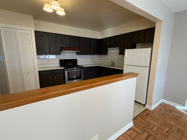 5240 Galitz Street, Unit 304 Skokie, IL 60077 - Photo 8 of 18 a kitchen with stainless steel appliances a refrigerator sink and stove