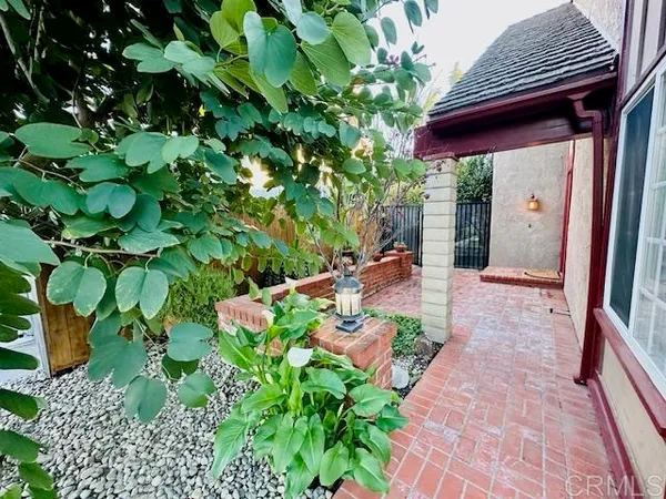 a view of a pathway with a patio