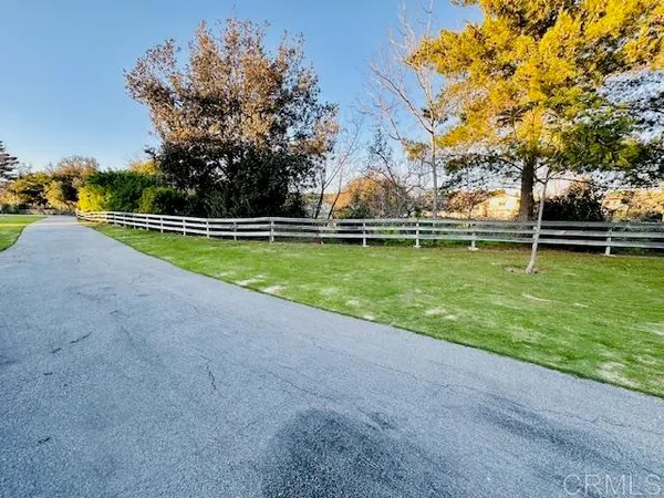 a view of a swimming pool with a yard