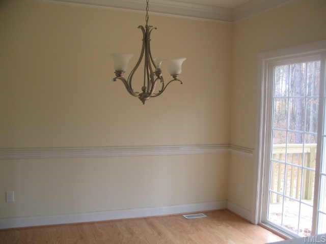 215 Waterfall Road Henderson, NC 27537 - Photo 6 of 10 Dining area w/ doors leading to rear deck.