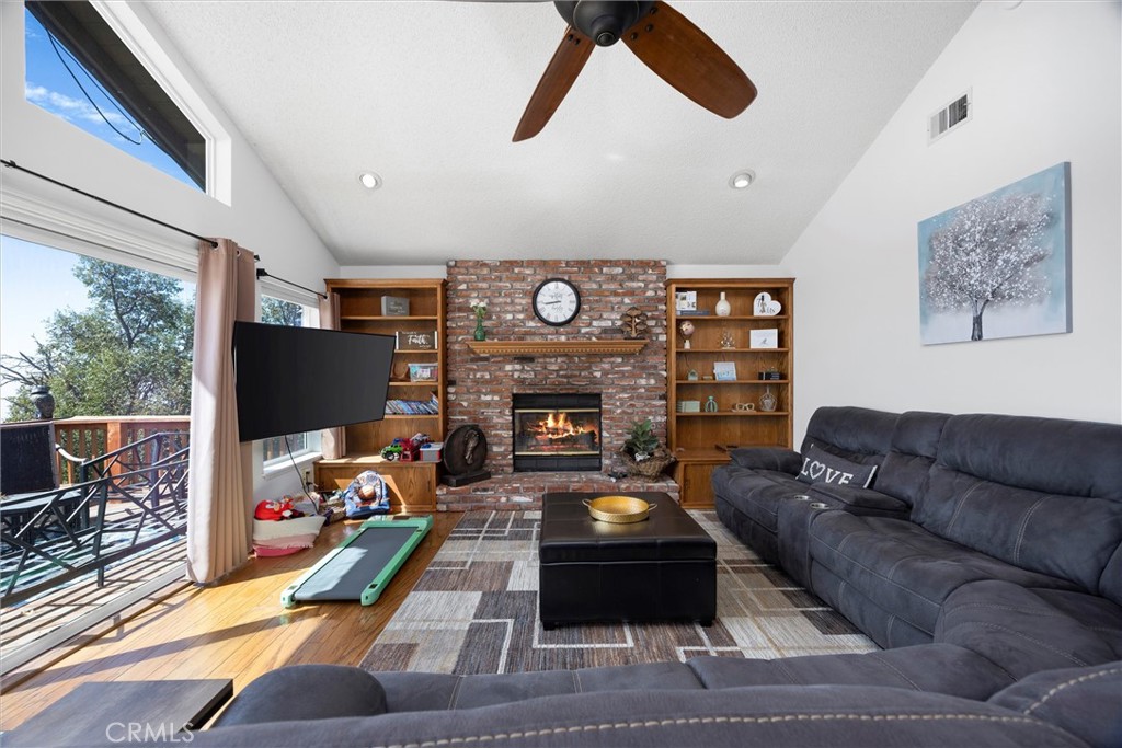26511 Teal Court Tehachapi, CA 93561 - Photo 14 of 68 a living room with furniture fireplace and flat screen tv