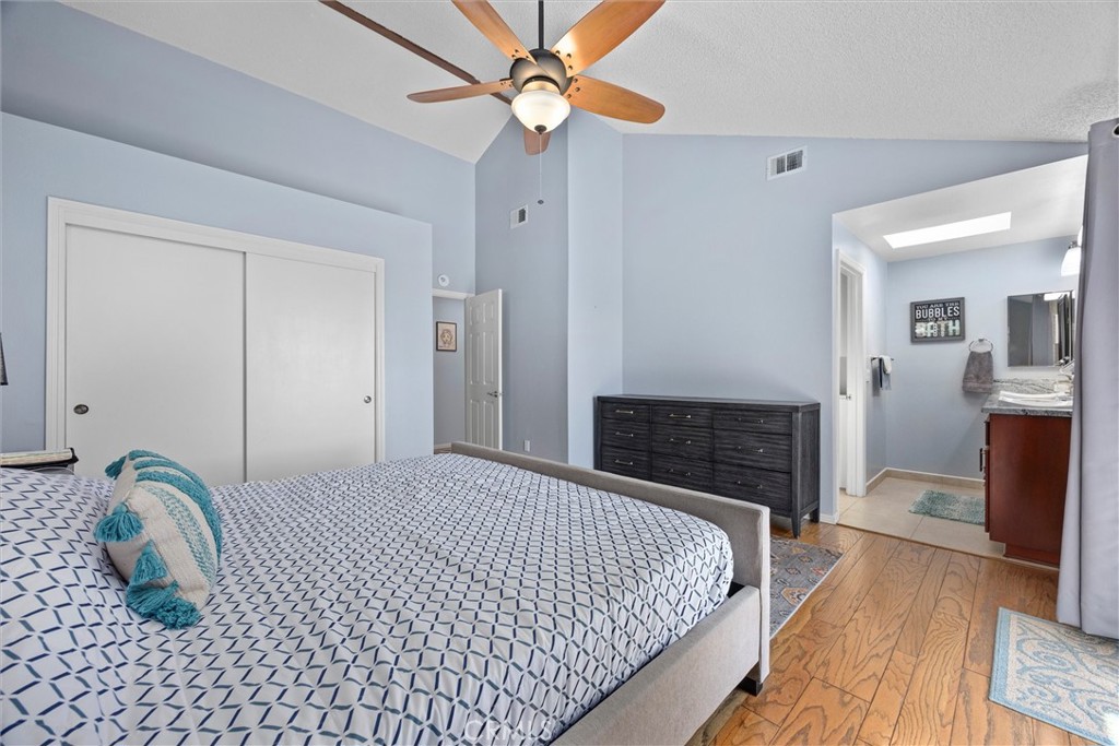 26511 Teal Court Tehachapi, CA 93561 - Photo 33 of 68 a bedroom with a bed and a fireplace