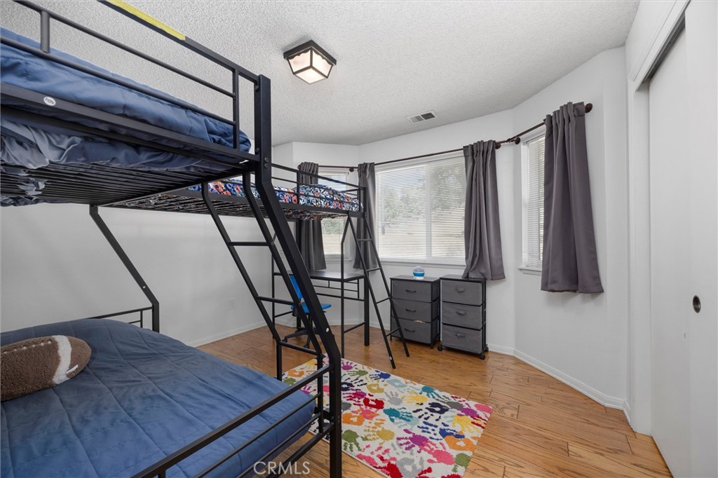 26511 Teal Court Tehachapi, CA 93561 - Photo 37 of 68 a bedroom with furniture and a window