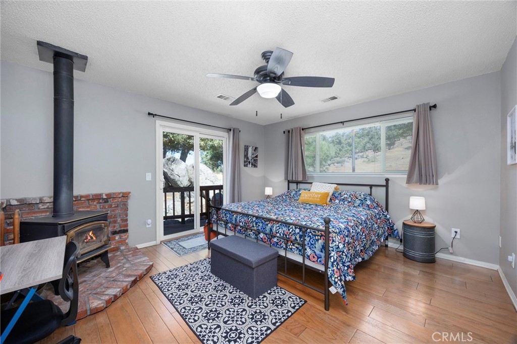 26511 Teal Court Tehachapi, CA 93561 - Photo 39 of 68 a bed room with a bed and a chandelier