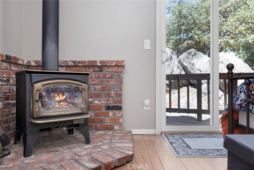 26511 Teal Court Tehachapi, CA 93561 - Photo 40 of 68 a living room with furniture a rug and a floor to ceiling window