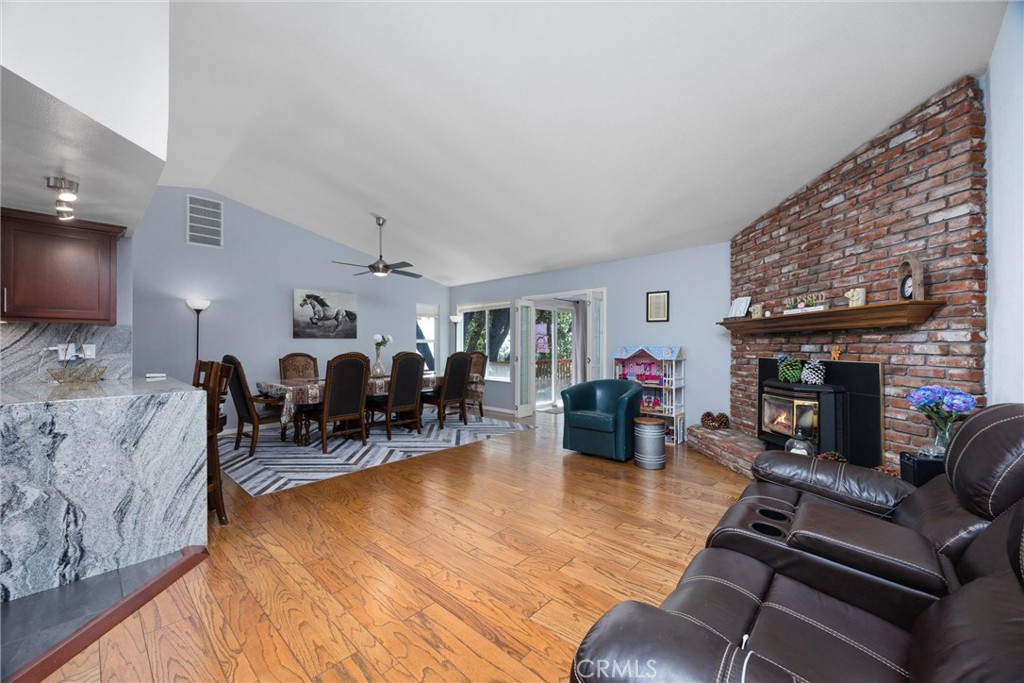 26511 Teal Court Tehachapi, CA 93561 - Photo 7 of 68 a living room with furniture and a fireplace