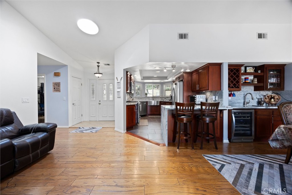 26511 Teal Court Tehachapi, CA 93561 - Photo 8 of 68 a living room with stainless steel appliances furniture a rug and a kitchen view