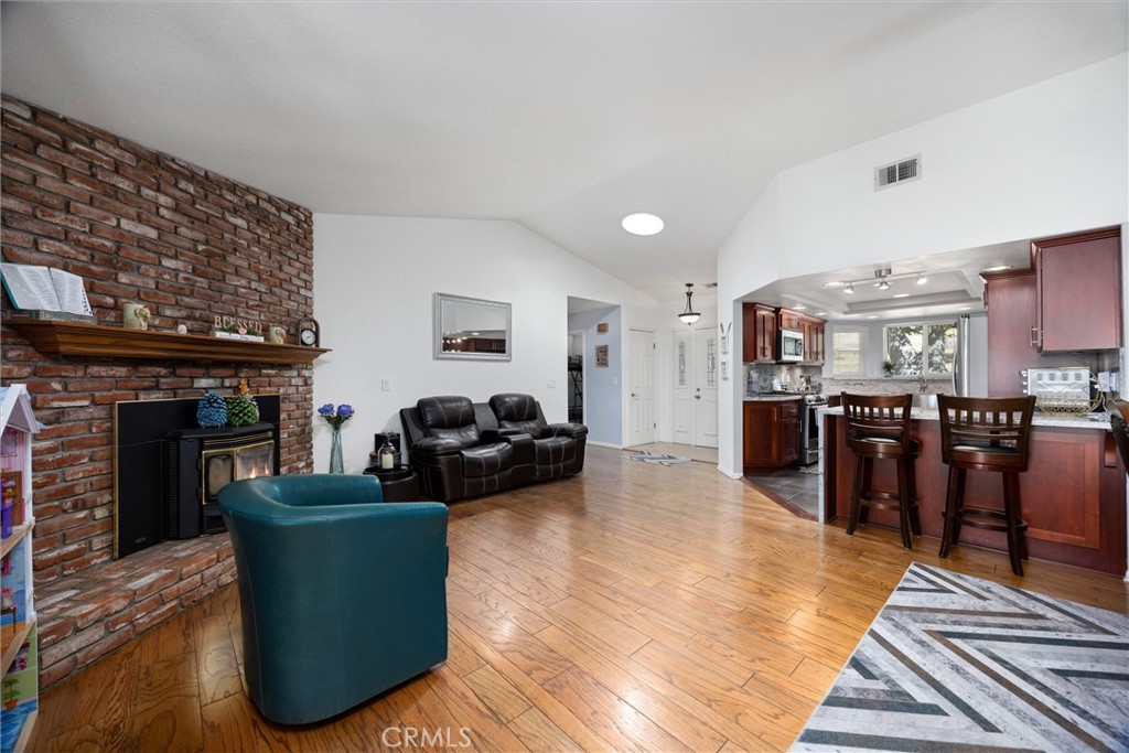26511 Teal Court Tehachapi, CA 93561 - Photo 10 of 68 a living room with furniture and a fireplace