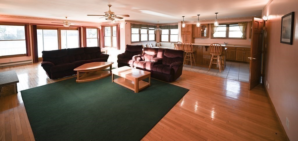 141 Ashby Road Ashburnham, MA 01430 - Photo 8 of 30 a living room with furniture wooden floor and a table