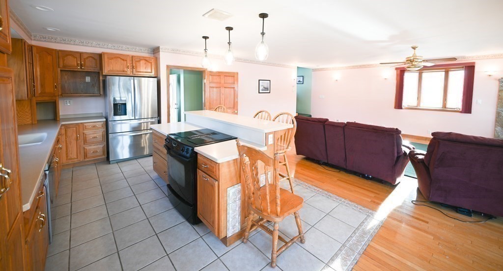 141 Ashby Road Ashburnham, MA 01430 - Photo 10 of 30 a kitchen with stainless steel appliances granite countertop a refrigerator and a stove