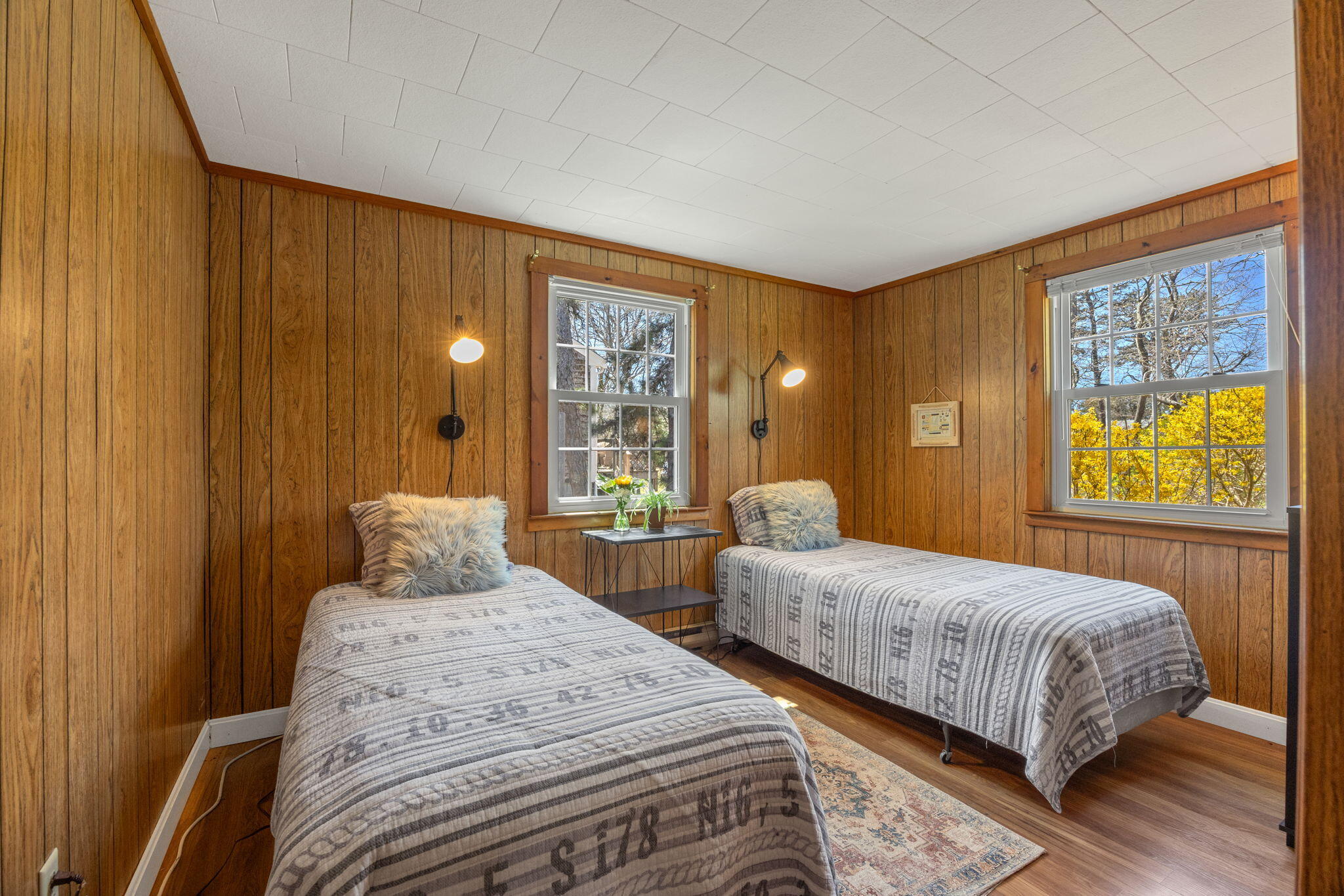 60 Long Avenue, Unit A Wellfleet, MA 02667 - Photo 18 of 28 a bedroom with two beds and a large window