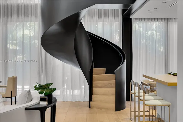 a kitchen with stainless steel appliances granite countertop a sink and a microwave