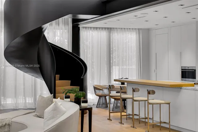 a bedroom with a bed window and flat screen tv