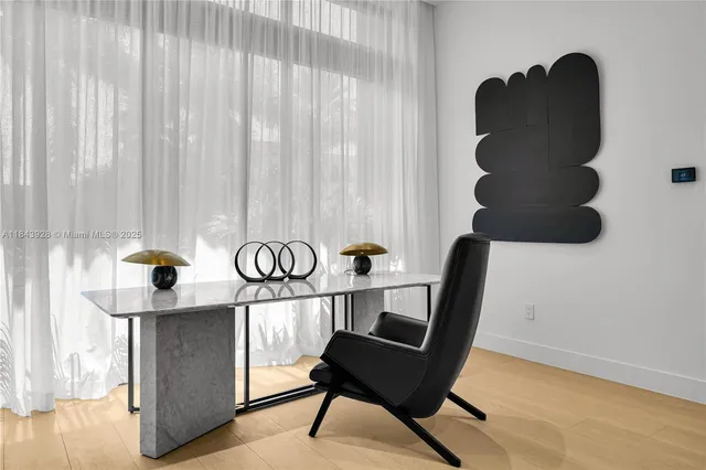 a bedroom with a bed and glass door