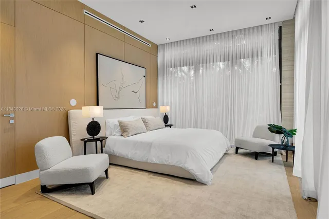 a bathroom with a granite countertop sink a toilet a mirror and shower