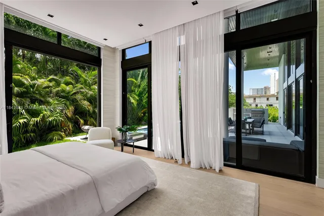 a view of a patio with table and chairs and potted plants