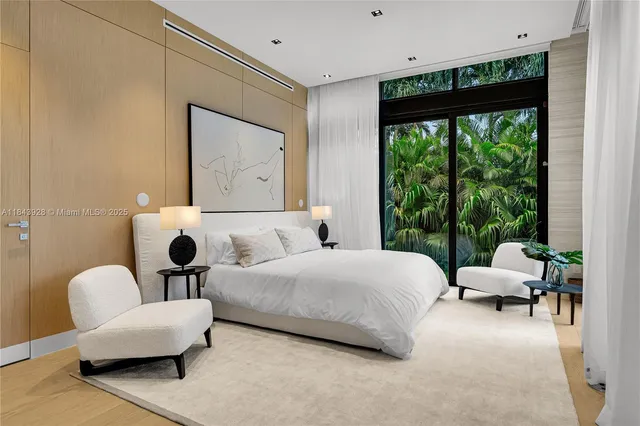 an aerial view of residential houses with outdoor space and street view