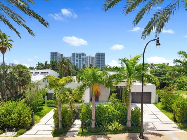 a living room with furniture kitchen and a table