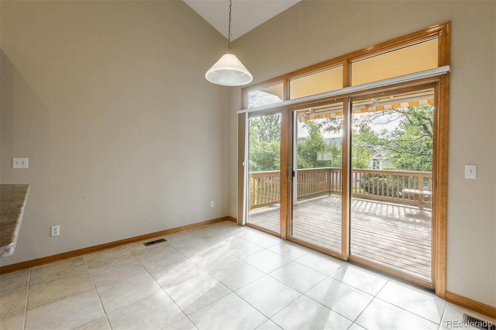 14 Hathaway Lane Highlands Ranch, CO 80130 - Photo 11 of 29 a view of an empty room and window ceiling fan