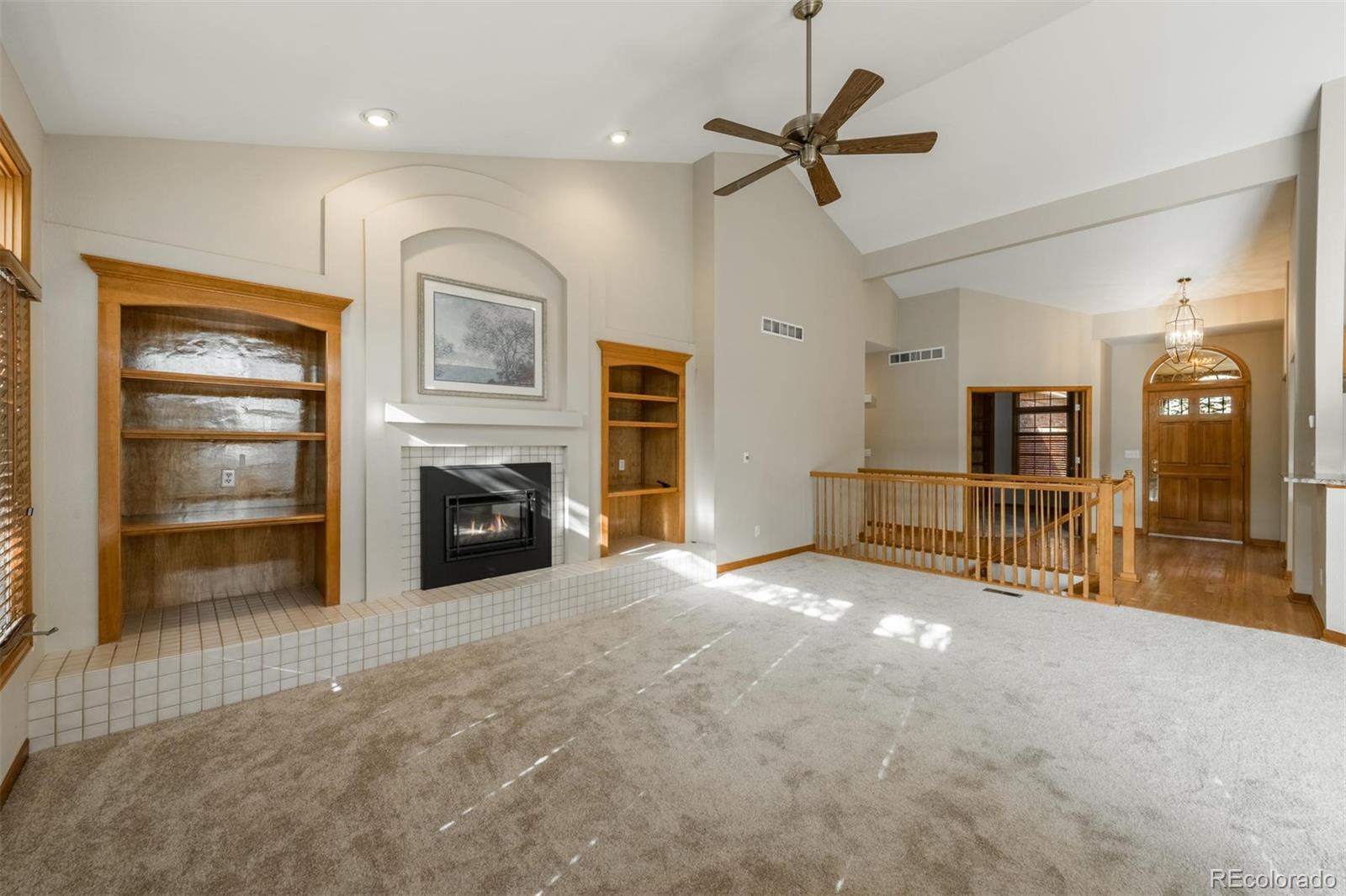 14 Hathaway Lane Highlands Ranch, CO 80130 - Photo 14 of 29 a view of an empty room with a fireplace and a window