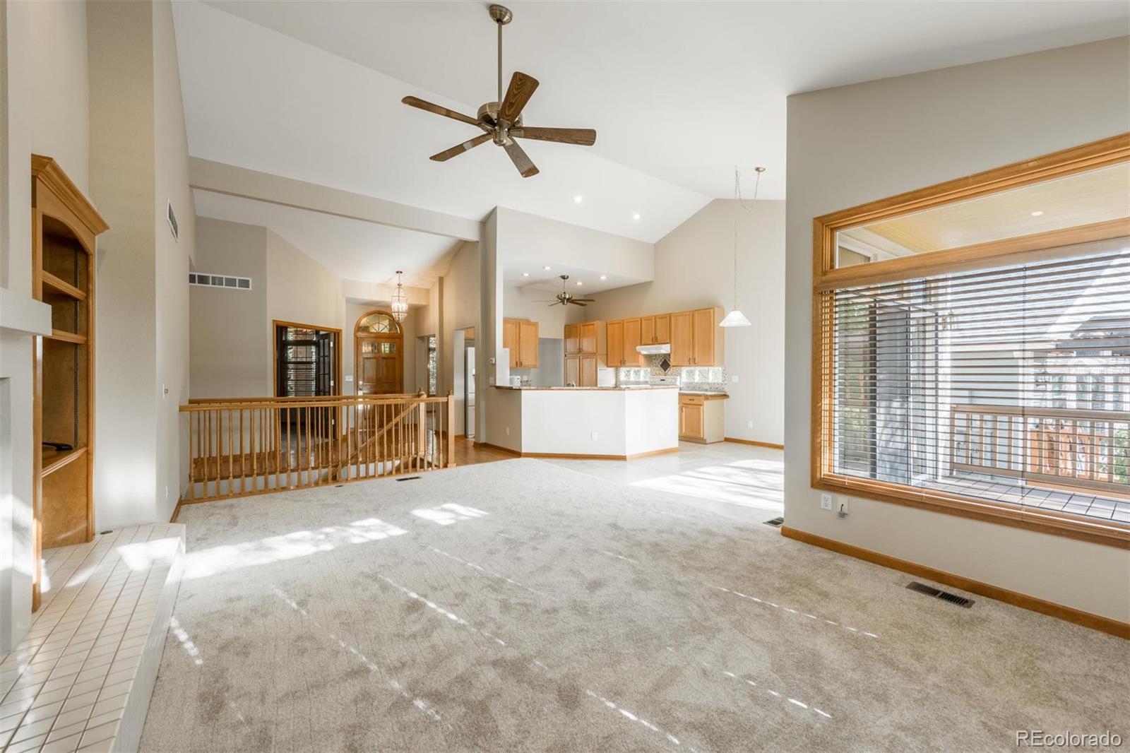14 Hathaway Lane Highlands Ranch, CO 80130 - Photo 15 of 29 a view of a livingroom with a flat screen tv wooden floor and a window