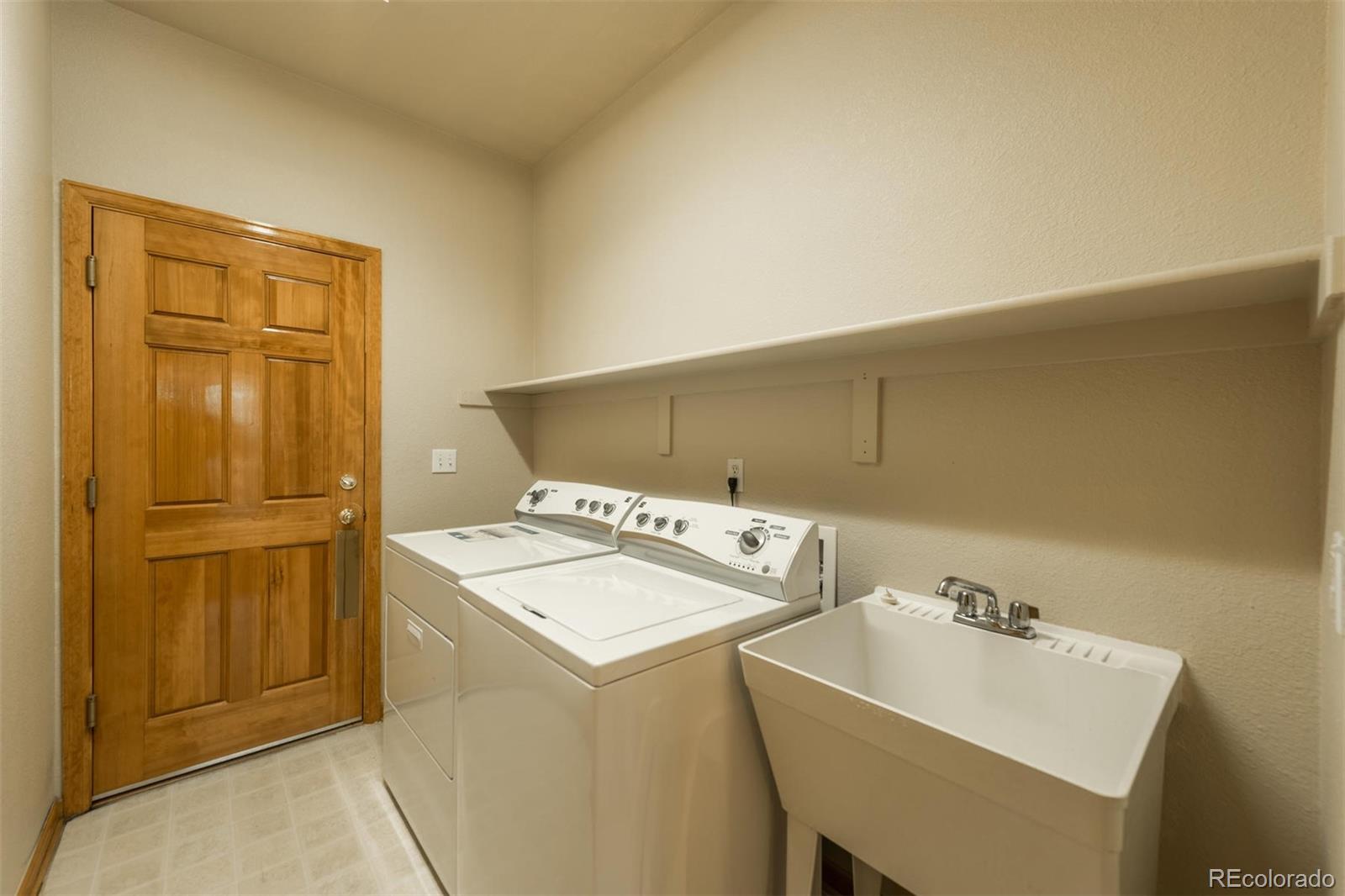 14 Hathaway Lane Highlands Ranch, CO 80130 - Photo 21 of 29 a utility room with dryer and washer