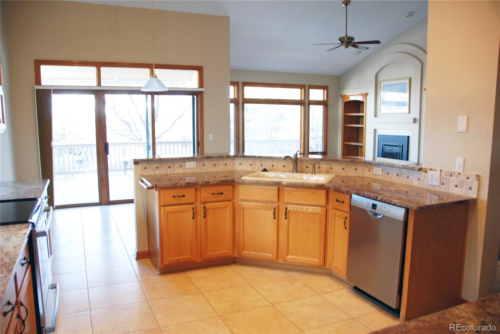 14 Hathaway Lane Highlands Ranch, CO 80130 - Photo 10 of 29 a kitchen with stainless steel appliances granite countertop a sink and a window