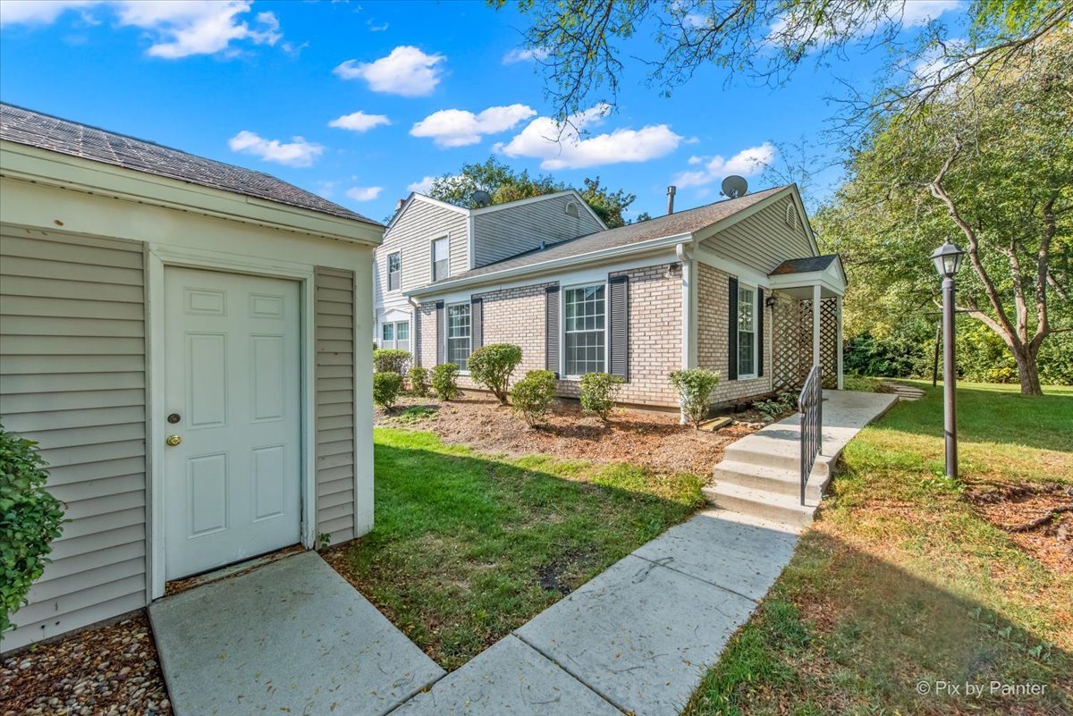 20 Red Oak Trail Cary, IL 60013 - Photo 2 of 27 a view of a house with backyard porch and sitting area