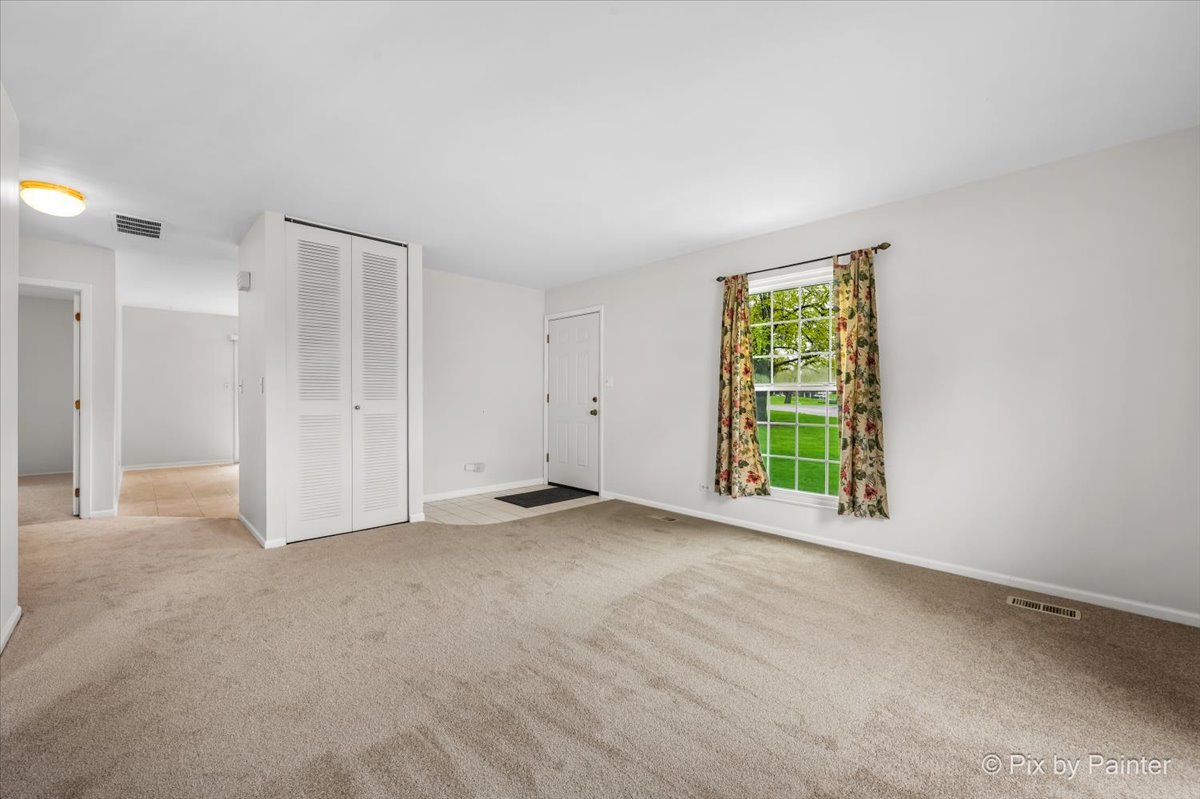 20 Red Oak Trail Cary, IL 60013 - Photo 4 of 27 a view of an empty room with a window
