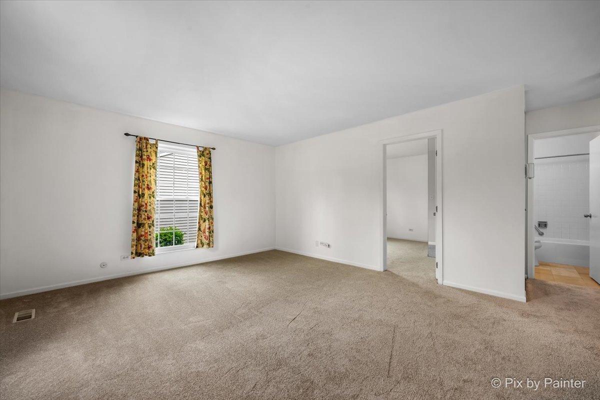 20 Red Oak Trail Cary, IL 60013 - Photo 6 of 27 a view of an empty room with a window