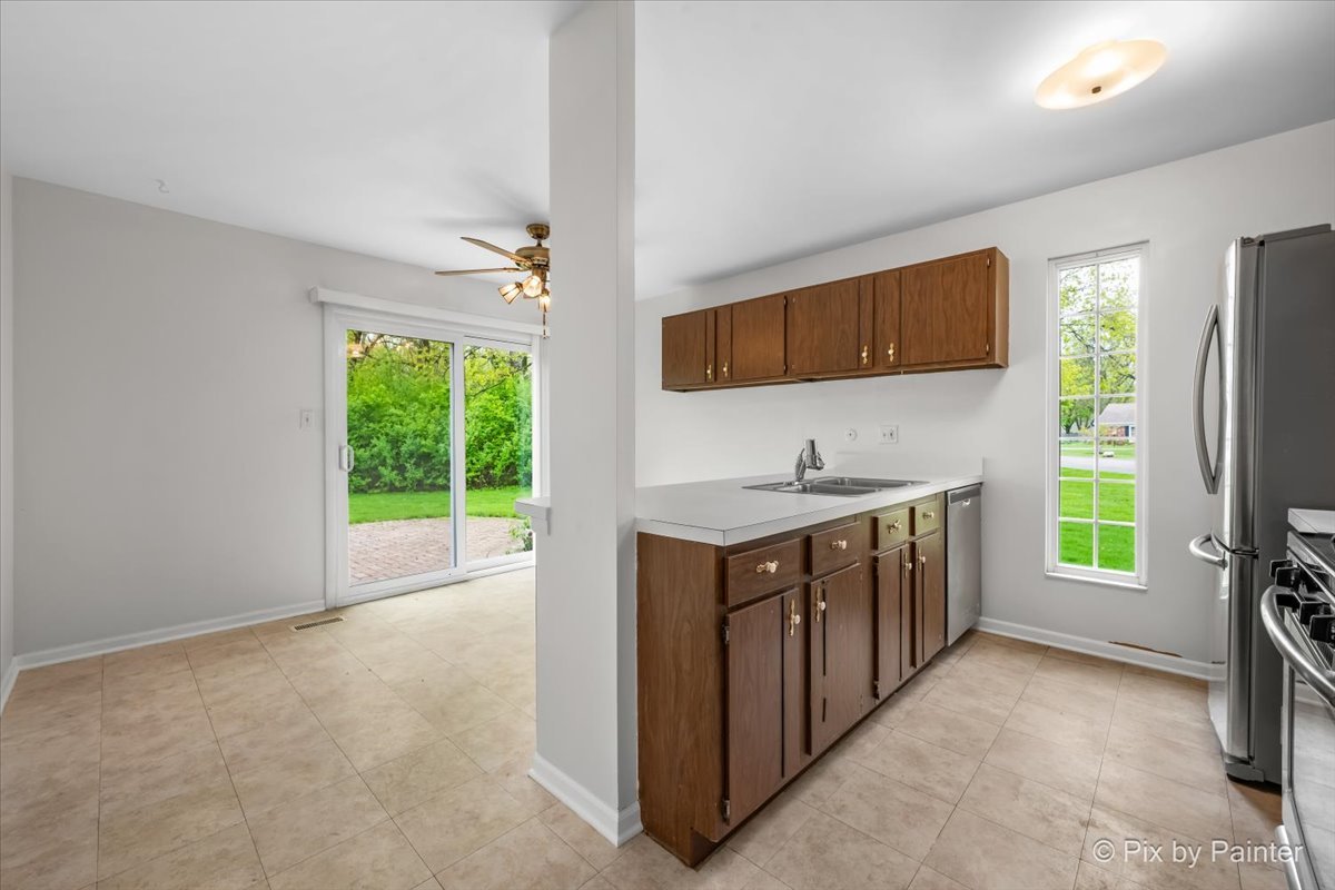 20 Red Oak Trail Cary, IL 60013 - Photo 8 of 27 a bathroom with a granite countertop sink and a window
