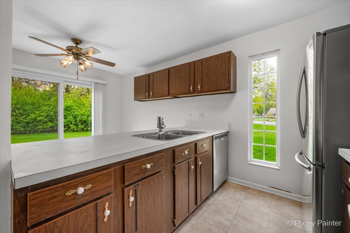 20 Red Oak Trail Cary, IL 60013 - Photo 10 of 27 a kitchen with a sink and a window