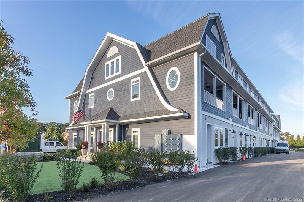 327 Reef Road, Unit 3 Fairfield, CT 06824 - Photo 1 of 1 a front view of a building with a street